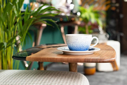 an end table where placed a coffee mug on it.