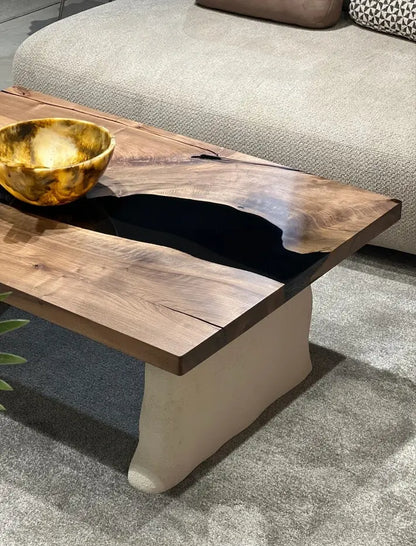 walnut coffee table with cement looking legs